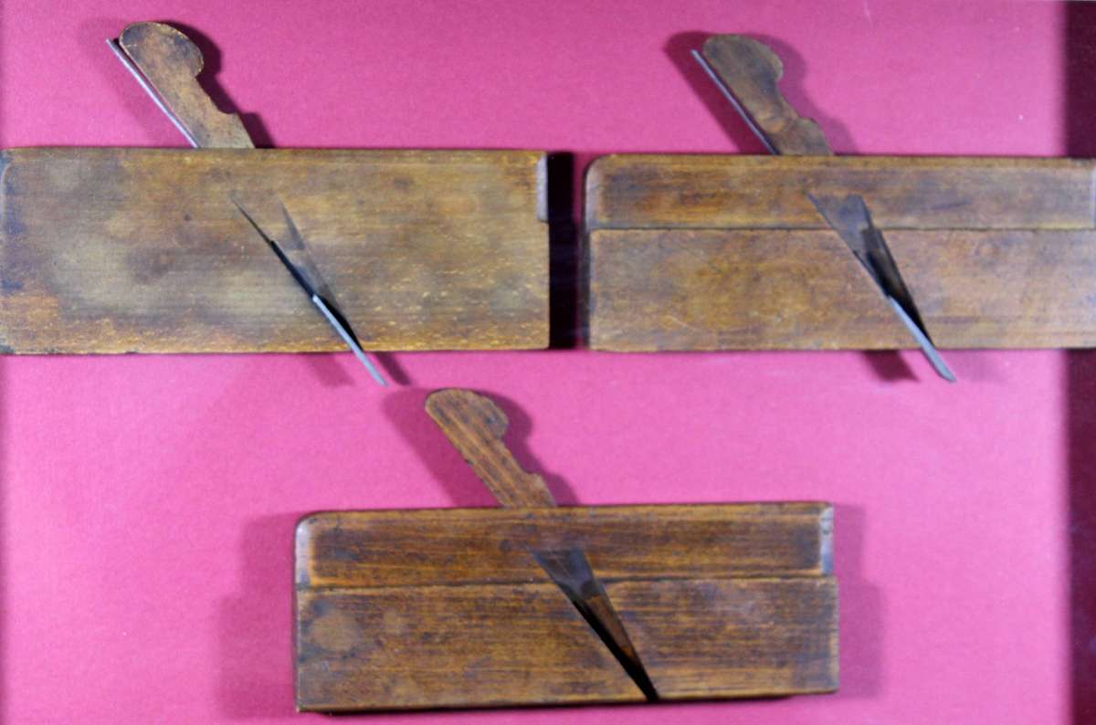 Antique wooden planes for moldings in a frame