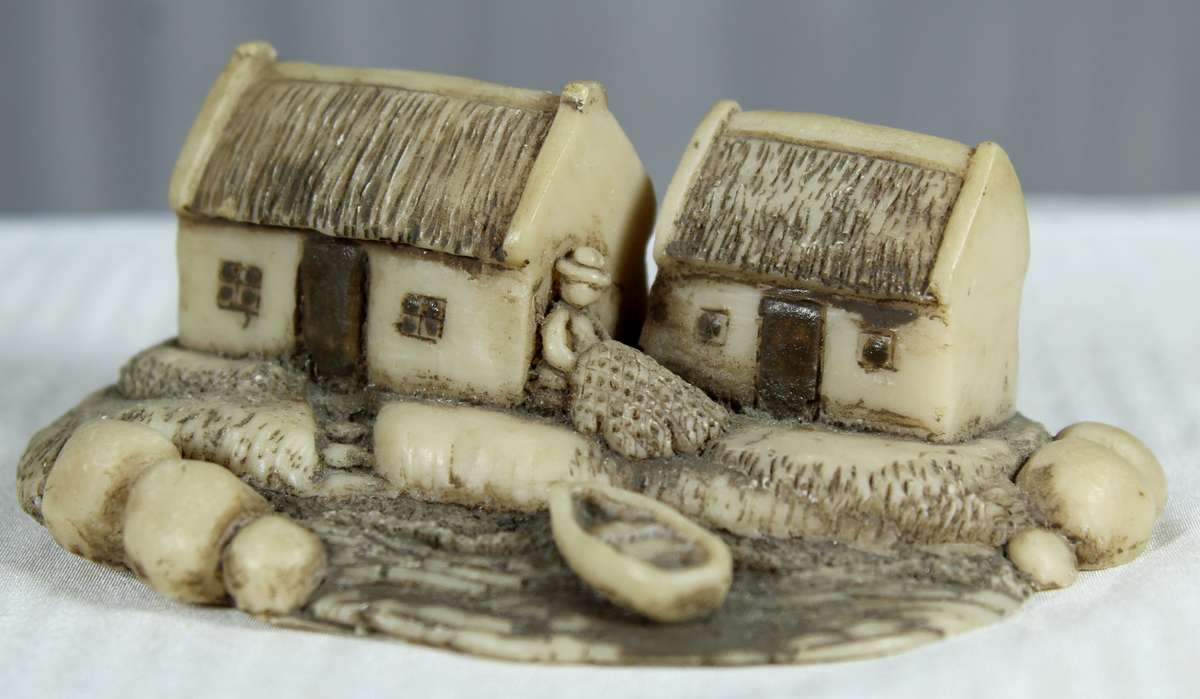 Miniature fishermen's houses with little boat