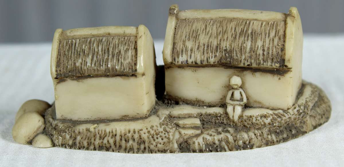 Miniature fishermen's houses with little boat