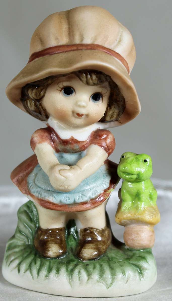 Little girl with a frog