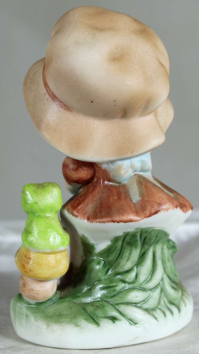 Little girl with a frog