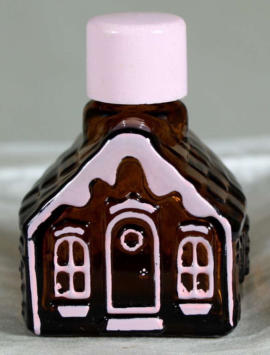 Avon miniature gingerbread house with pink trim