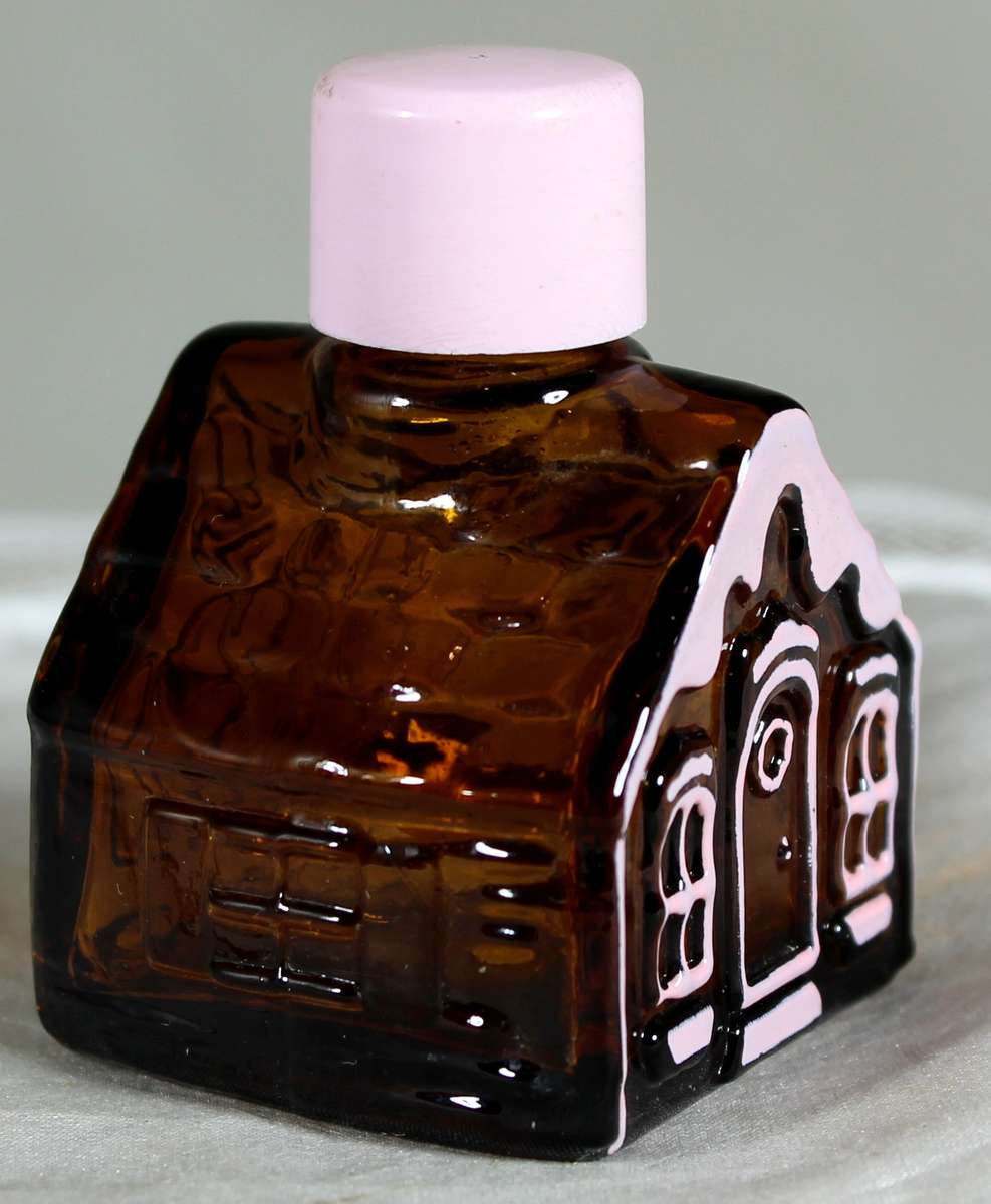 Avon miniature gingerbread house with pink trim