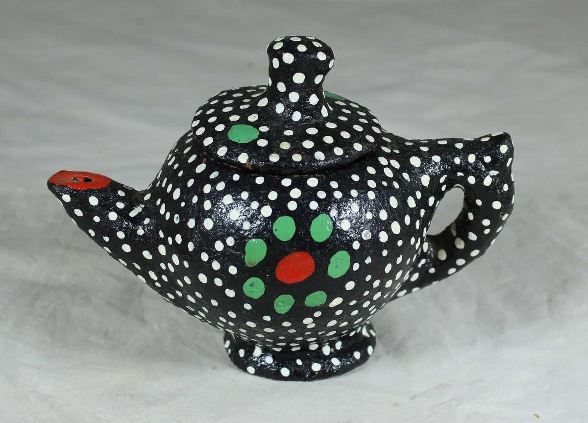Ornamental pottery kettle with hand painted polka dots