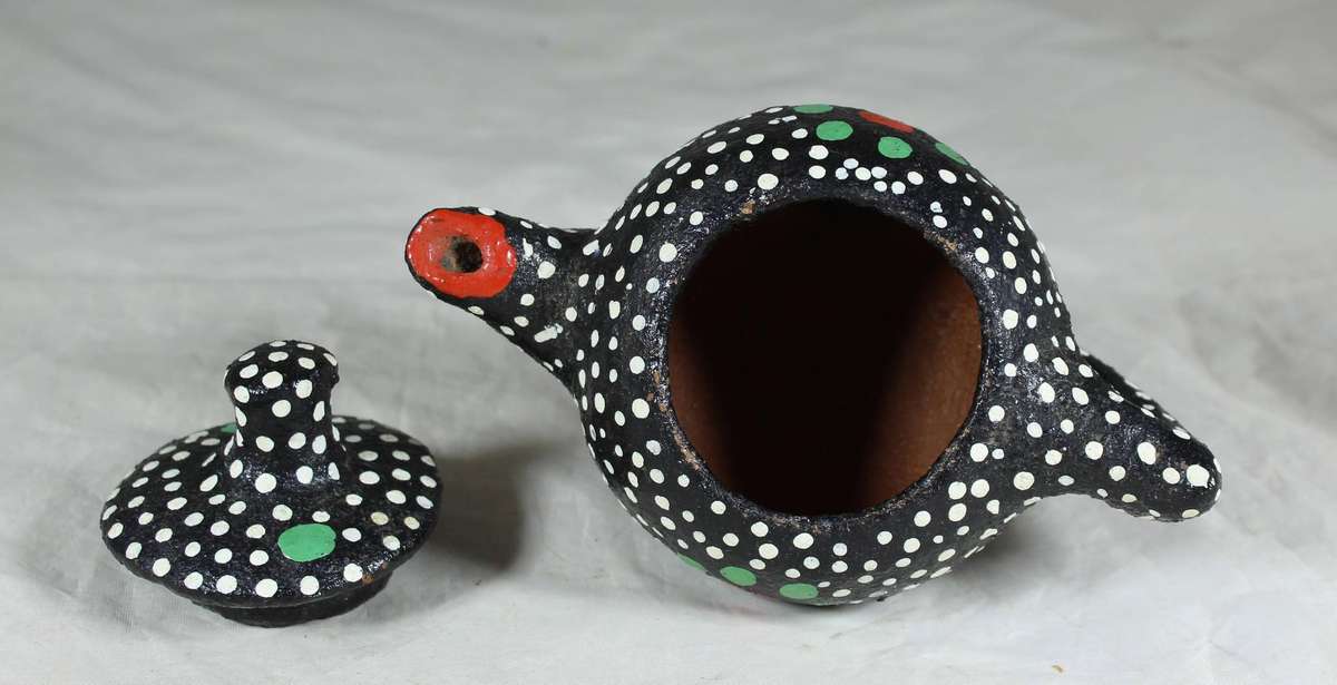 Ornamental pottery kettle with hand painted polka dots