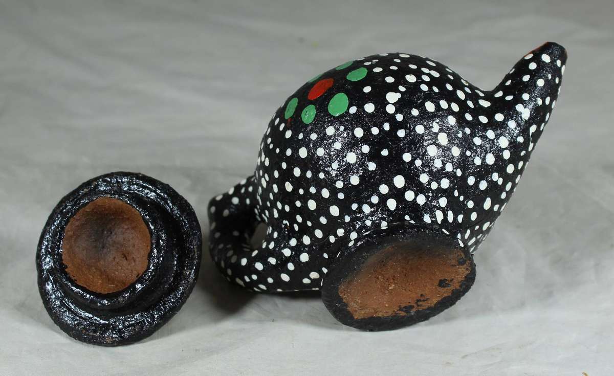 Ornamental pottery kettle with hand painted polka dots