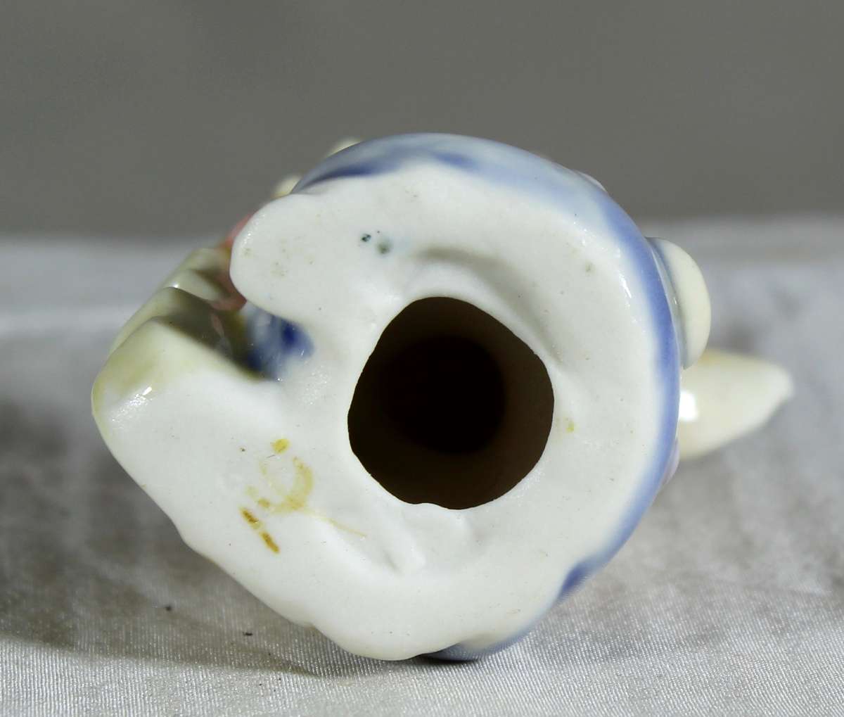 Miniature glazed ceramic bunny playing a bass - white ears