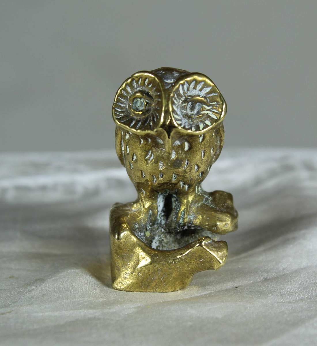 Miniature brass owl on a stump
