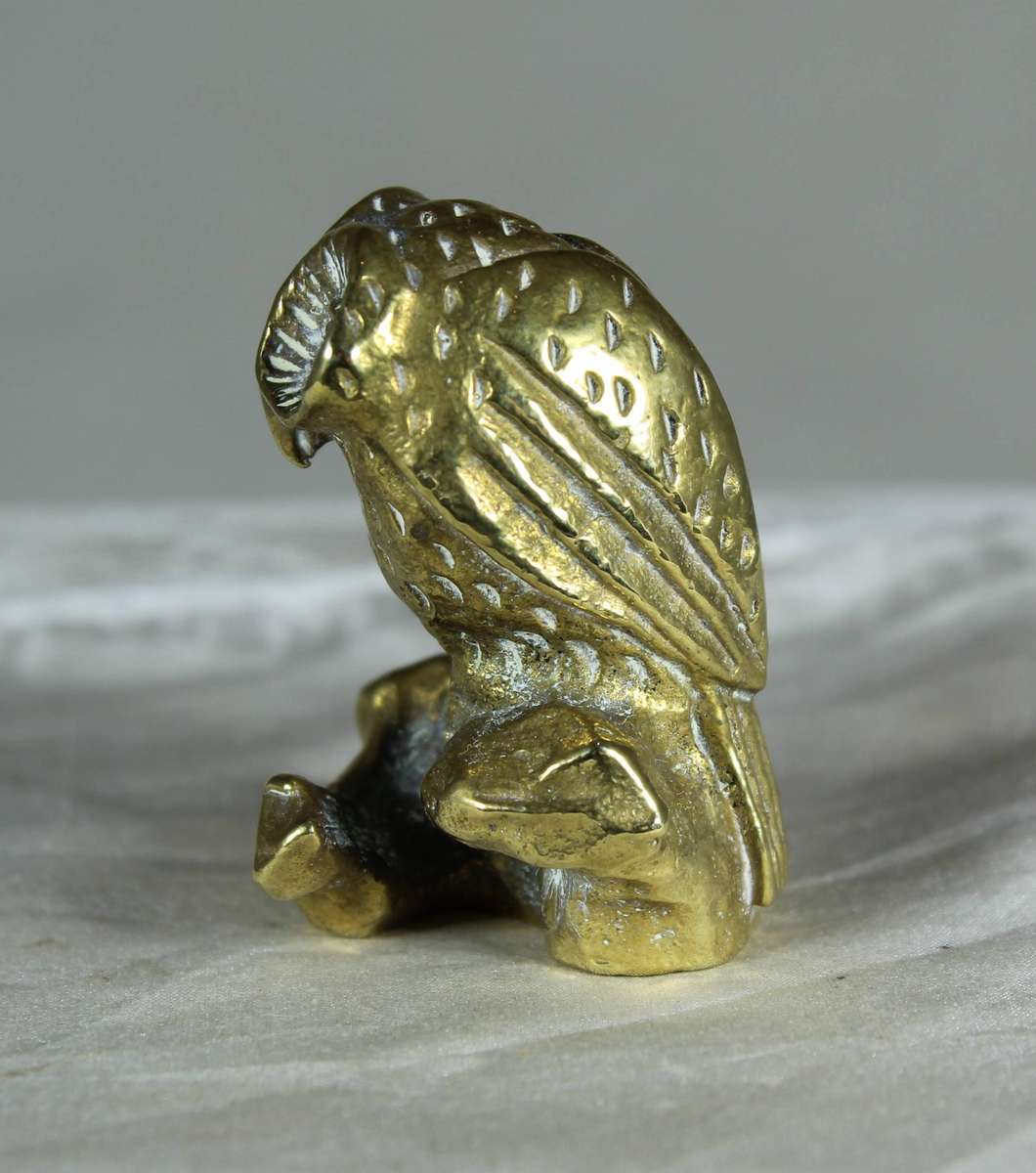 Miniature brass owl on a stump