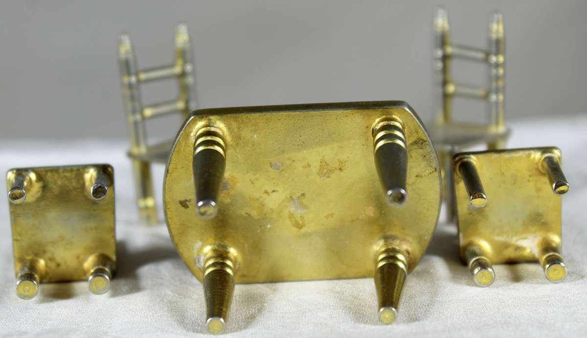 Miniature brass table with four chairs