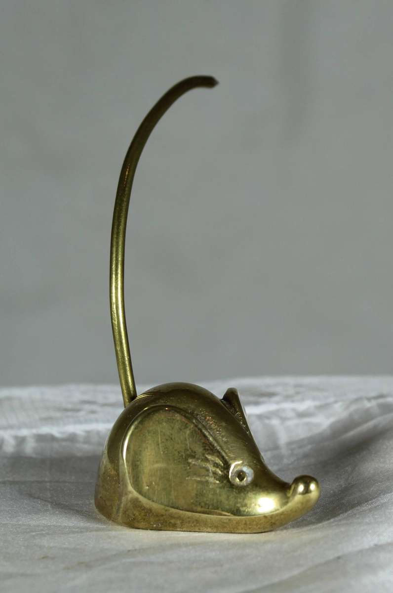 Miniature brass mouse with a brass tail