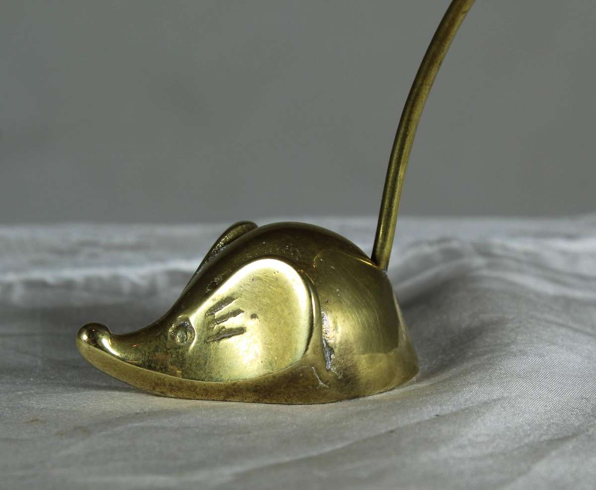 Miniature brass mouse with a brass tail