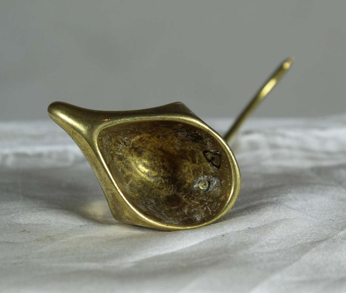Miniature brass mouse with a brass tail