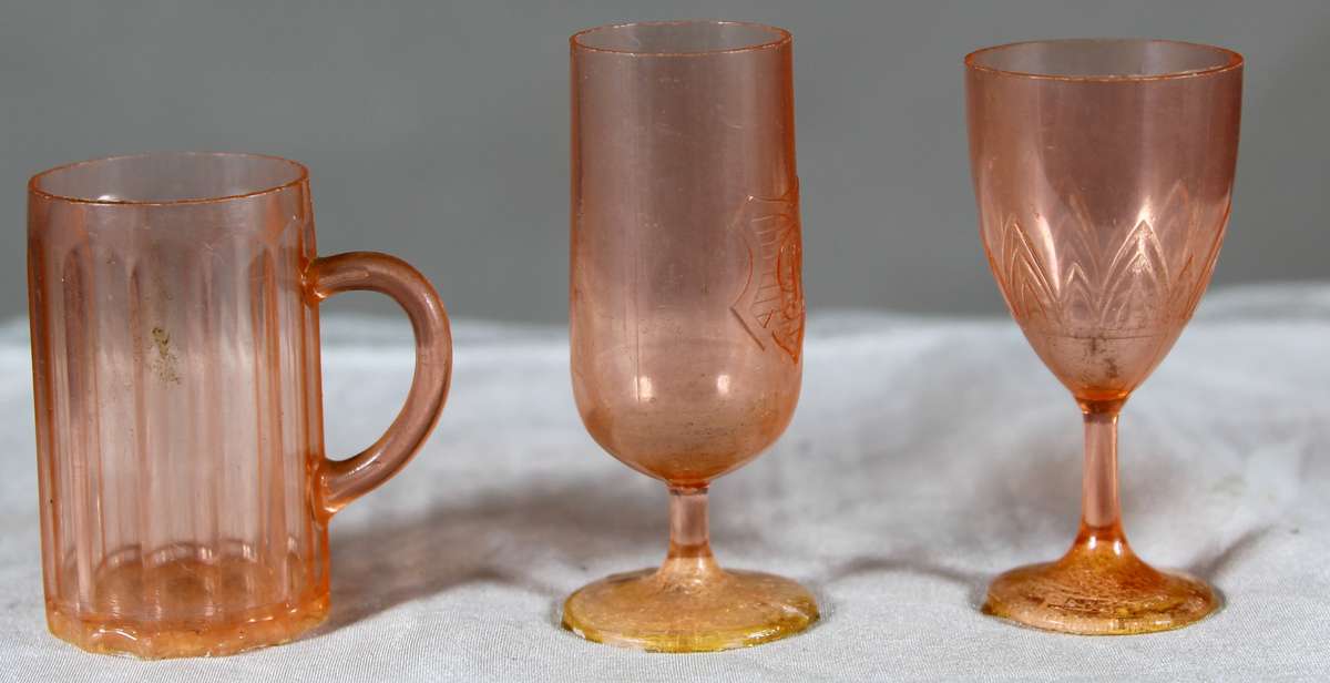 Trio of plastic glasses and mug