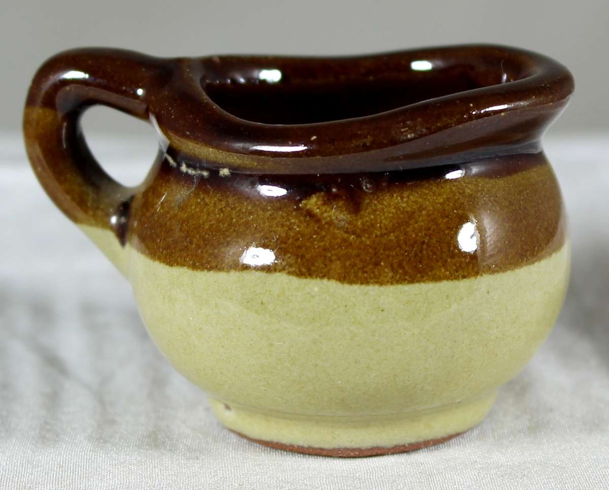 Miniature pottery milk jug