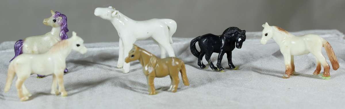 Set of six miniature horses - plastic and one glass
