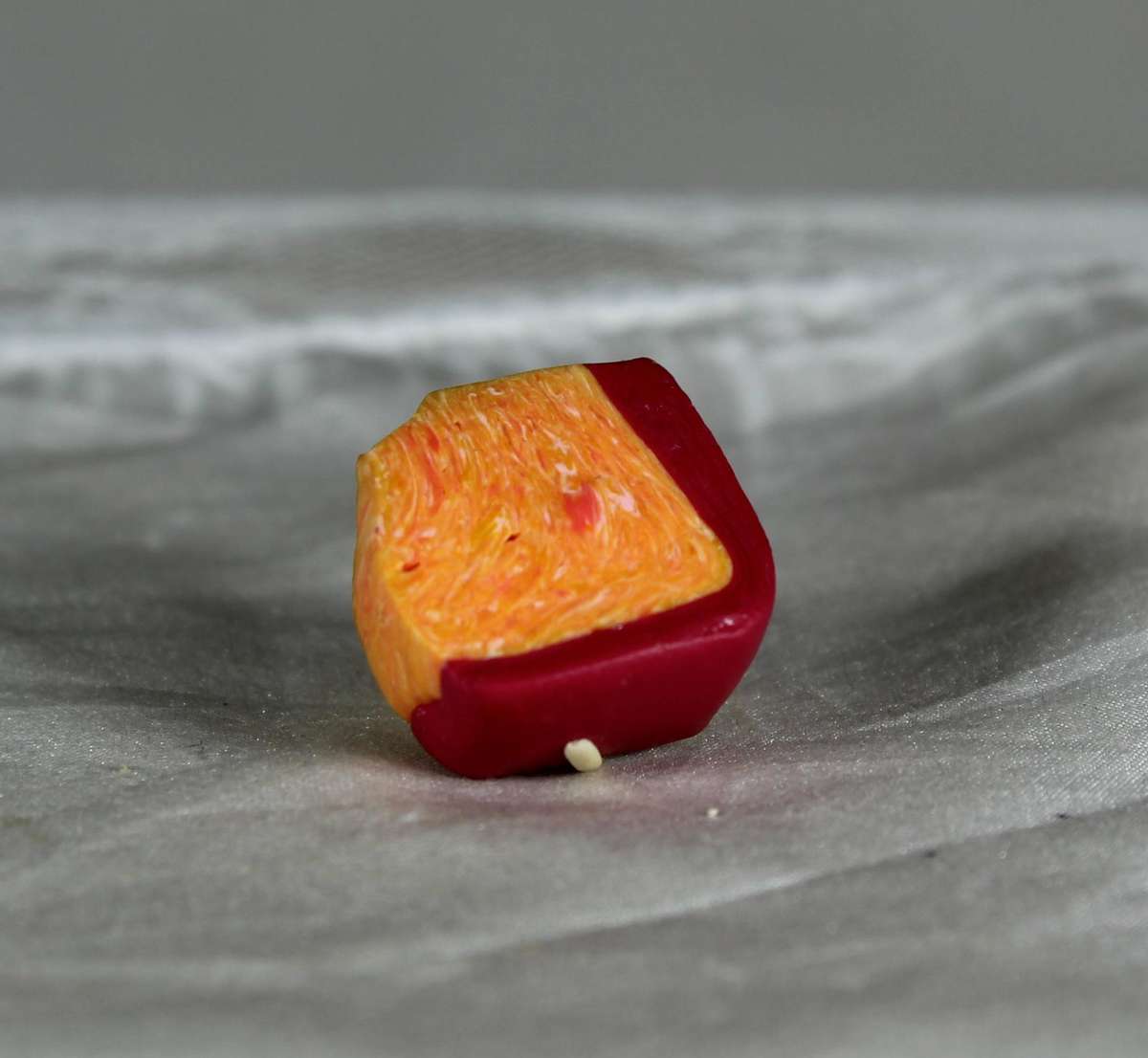 Mini miniature mouse on a slice of cheese