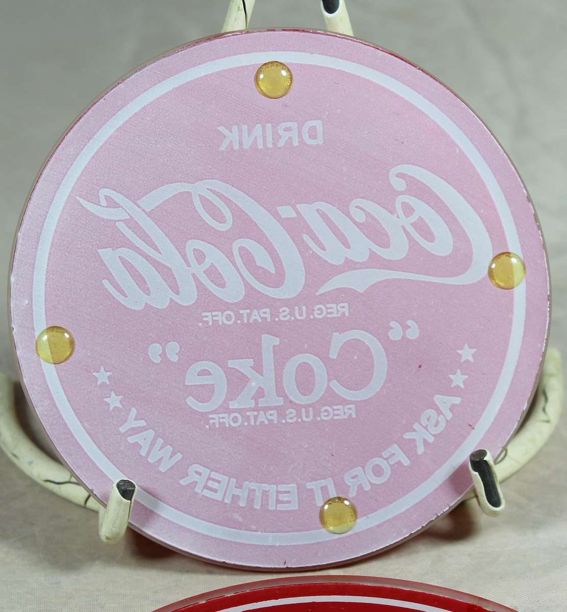 Four glass Coca-Cola coasters