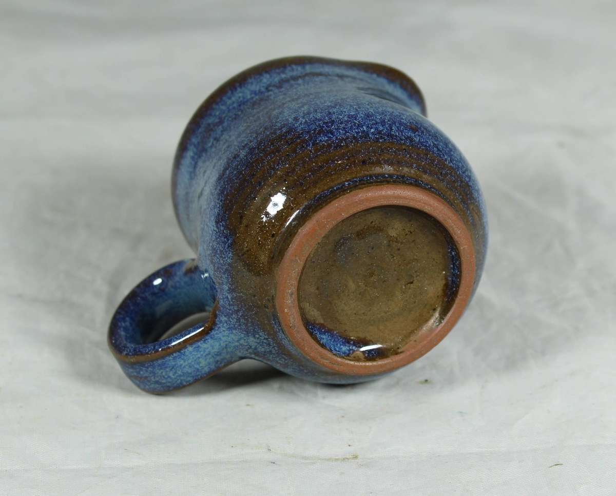 Small pottery milk jug