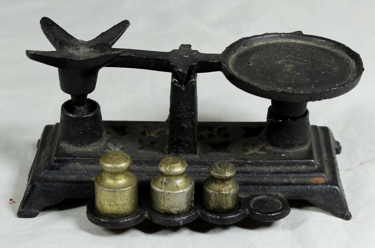 Small cast metal scale