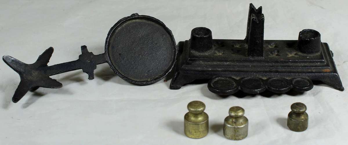 Small cast metal scale