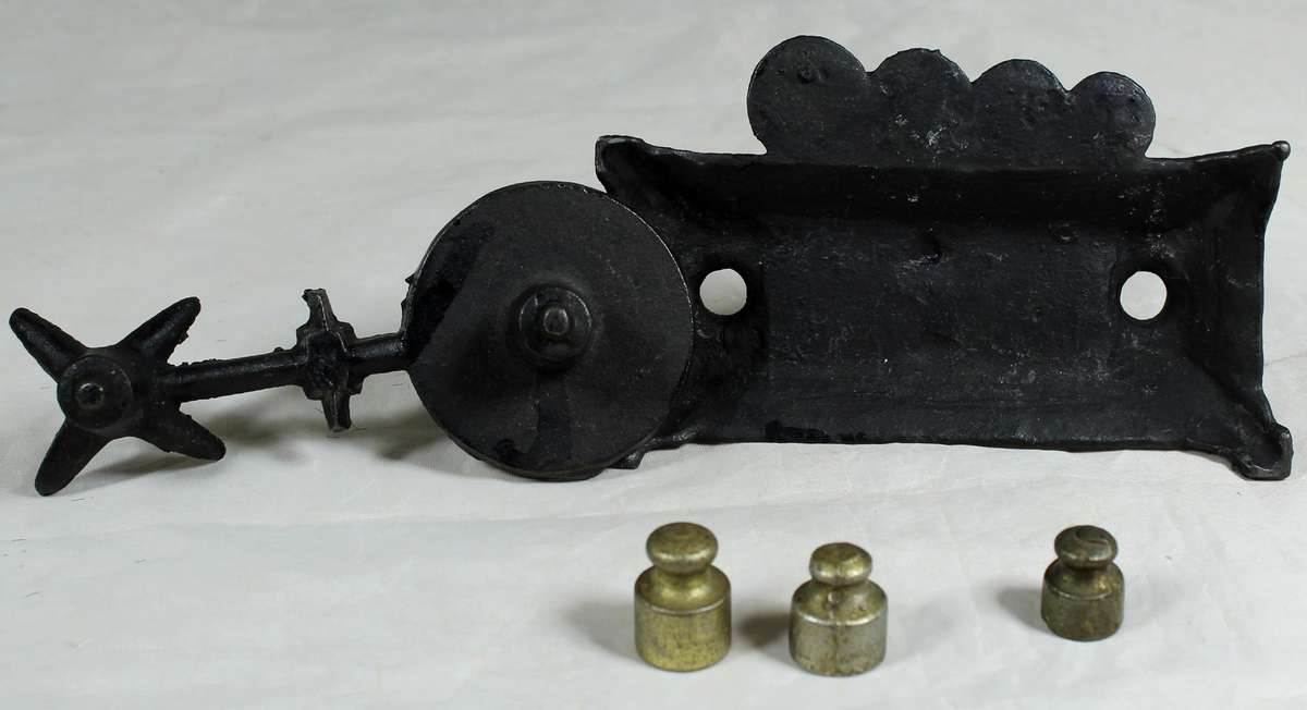 Small cast metal scale