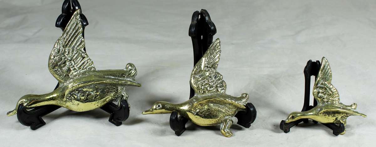 Trio of flying brass geese