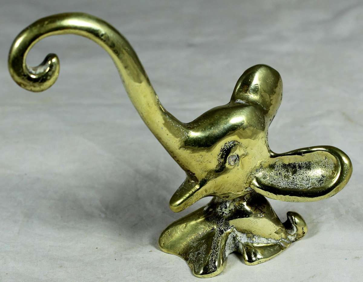 Brass elephant with long trunk