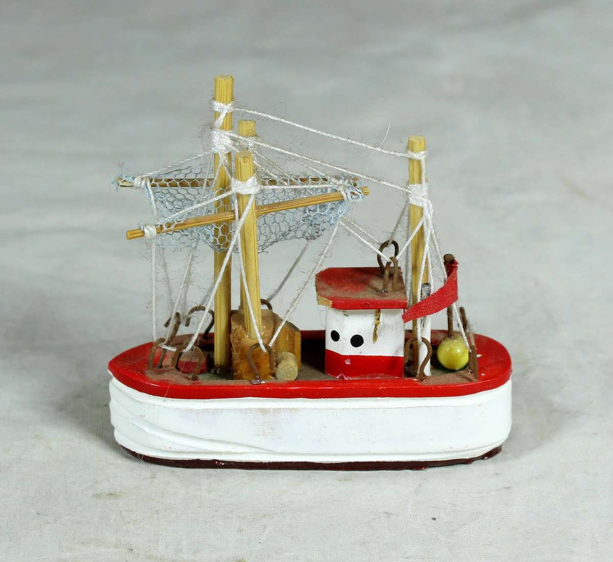 Miniature red fishers boat
