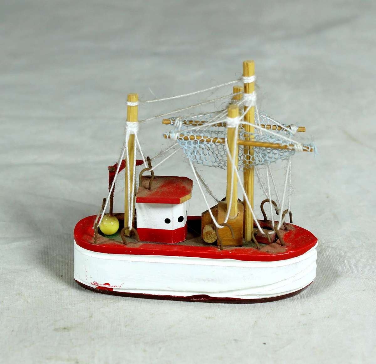 Miniature red fishers boat