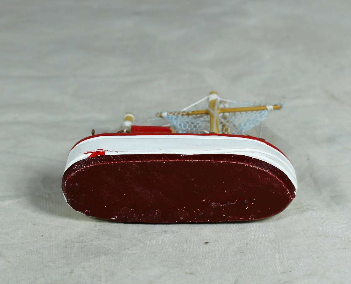 Miniature red fishers boat