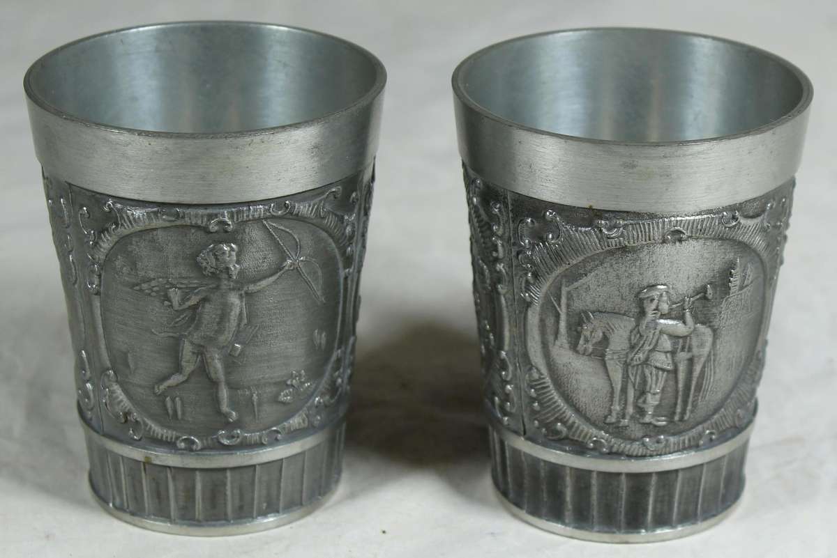 Pair of embossed pewter drinking cups