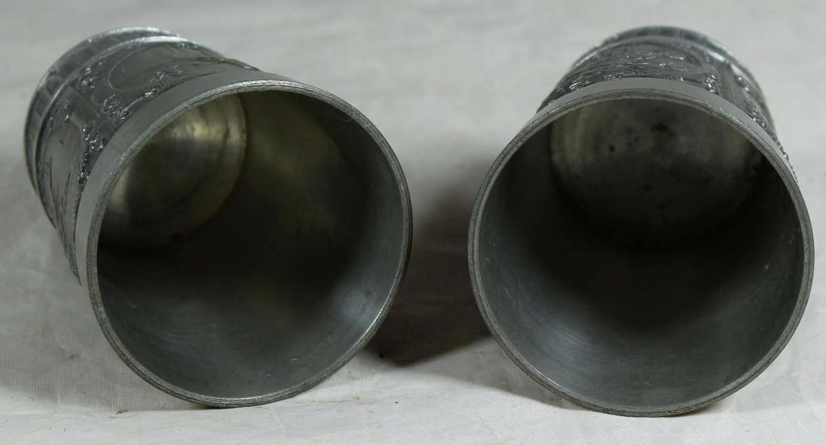 Pair of embossed pewter drinking cups