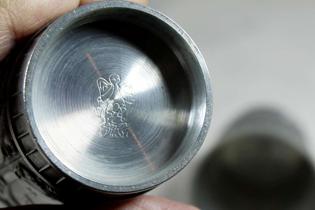 Pair of embossed pewter drinking cups