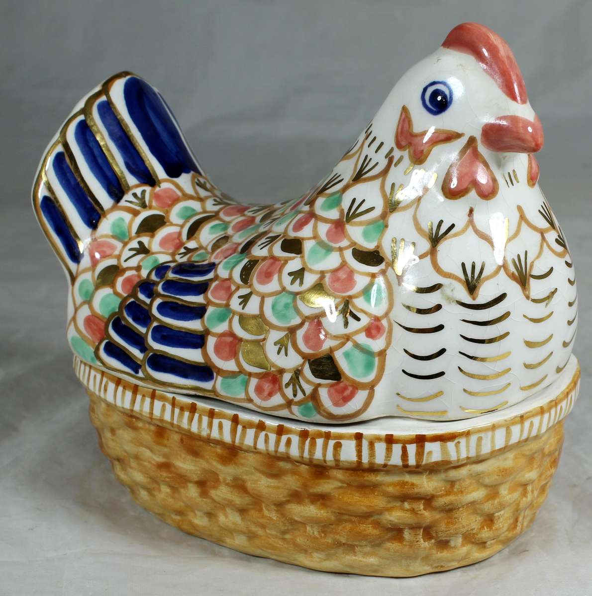 Bowl with multi colored chicken shaped lid