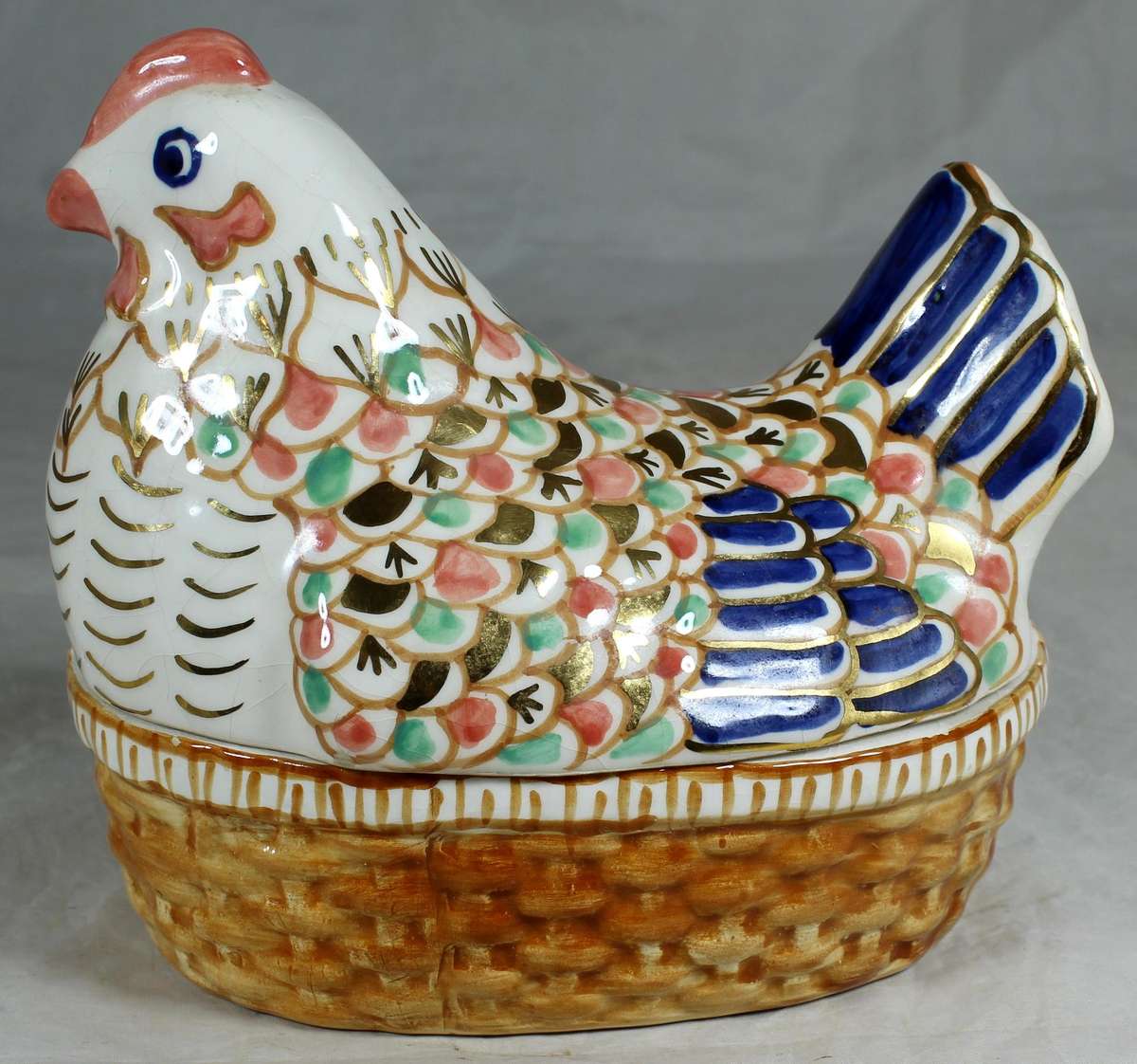 Bowl with multi colored chicken shaped lid