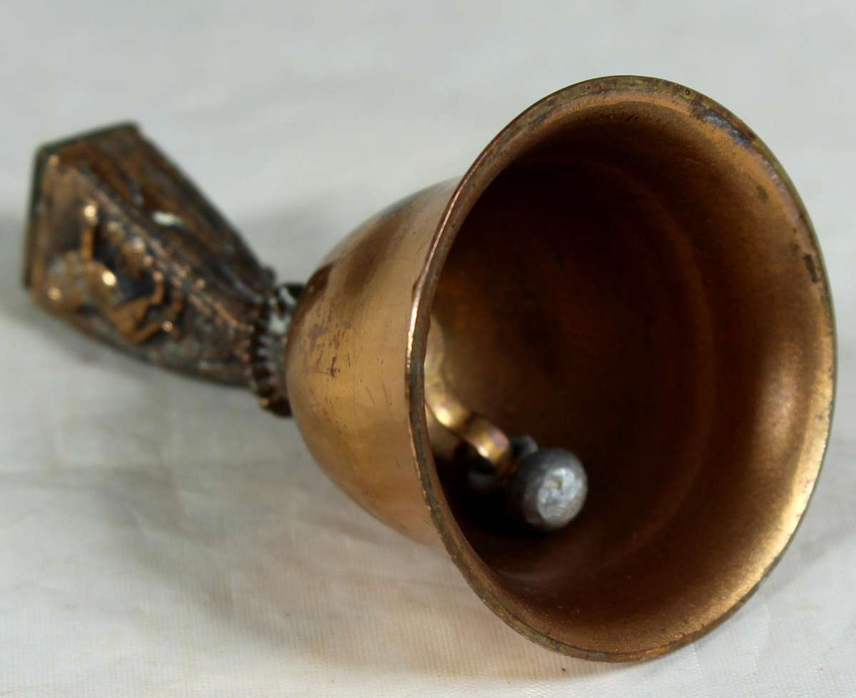 Souvenir copper bell - Kruger park with lion topped figure embossed to shield