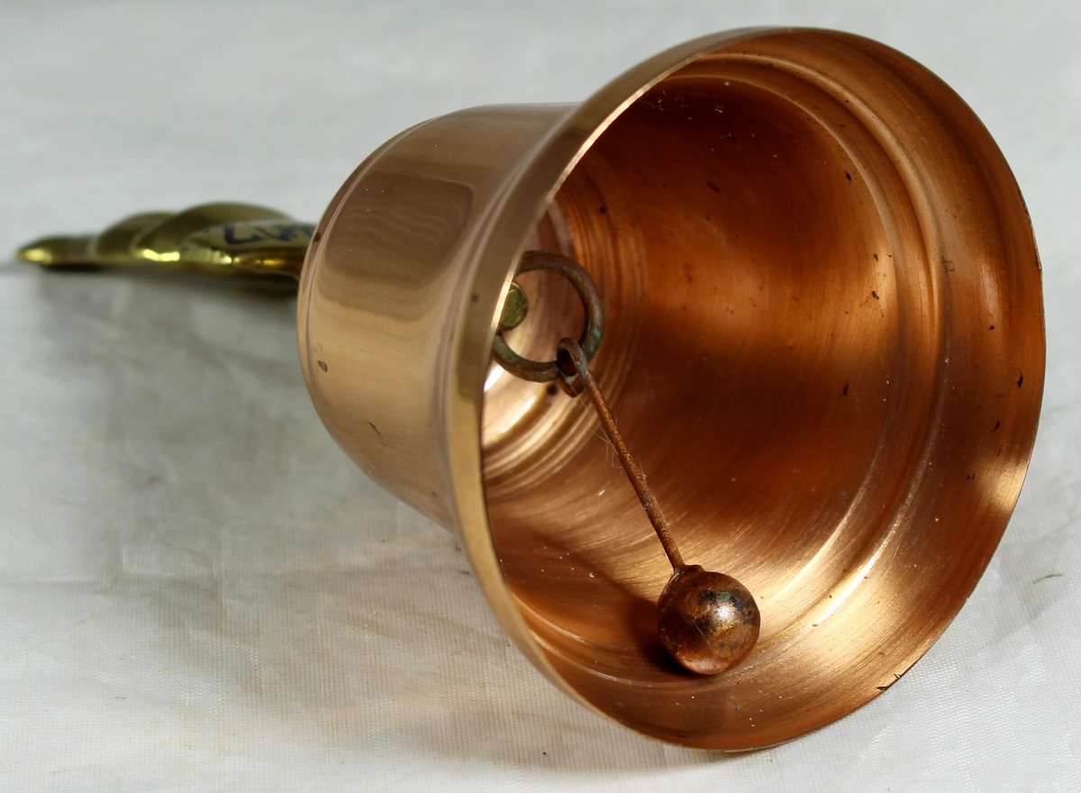 Souvenir copper bell with Zimbabwe bateleur eagle