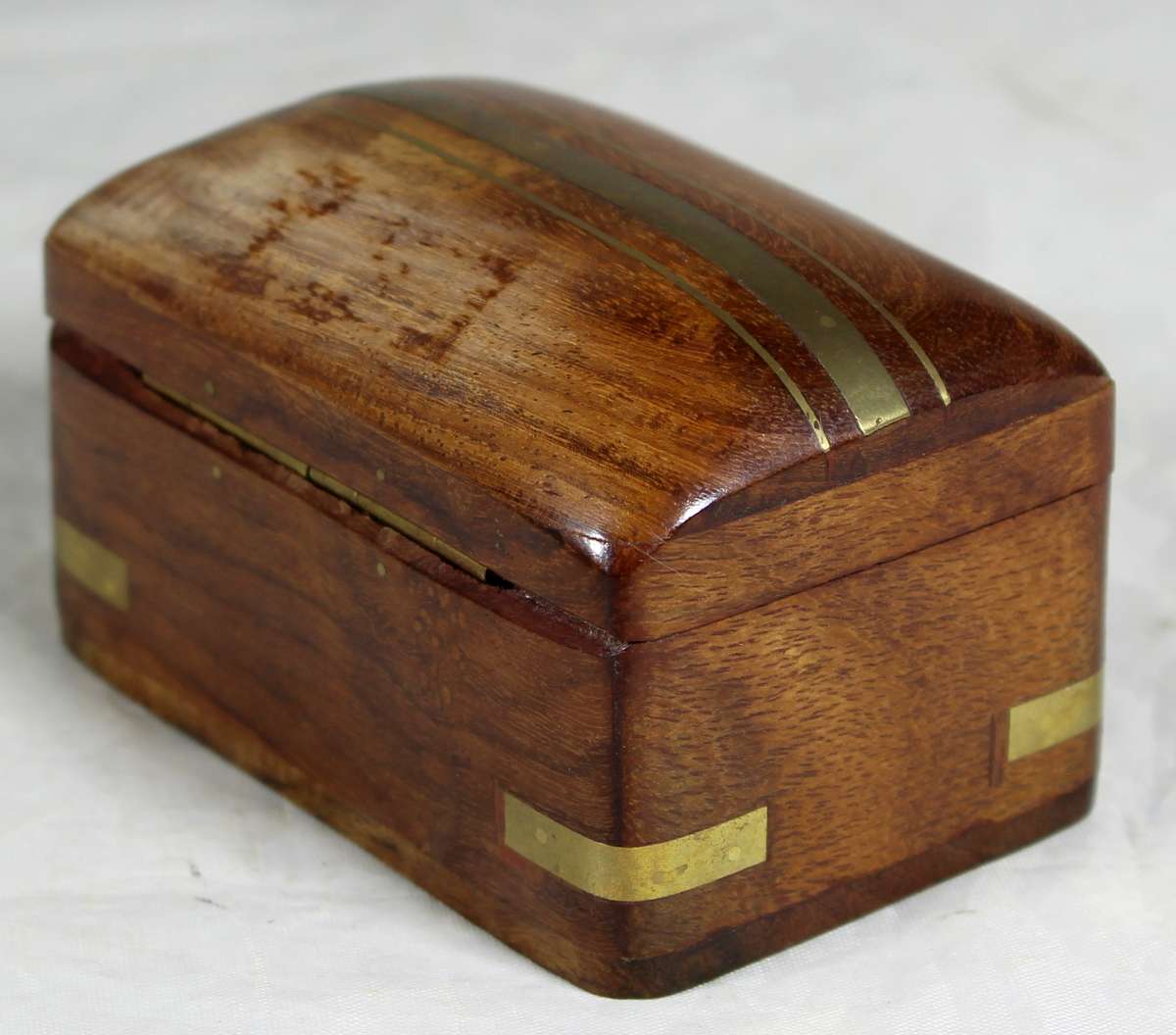Small wooden box with brass inlay