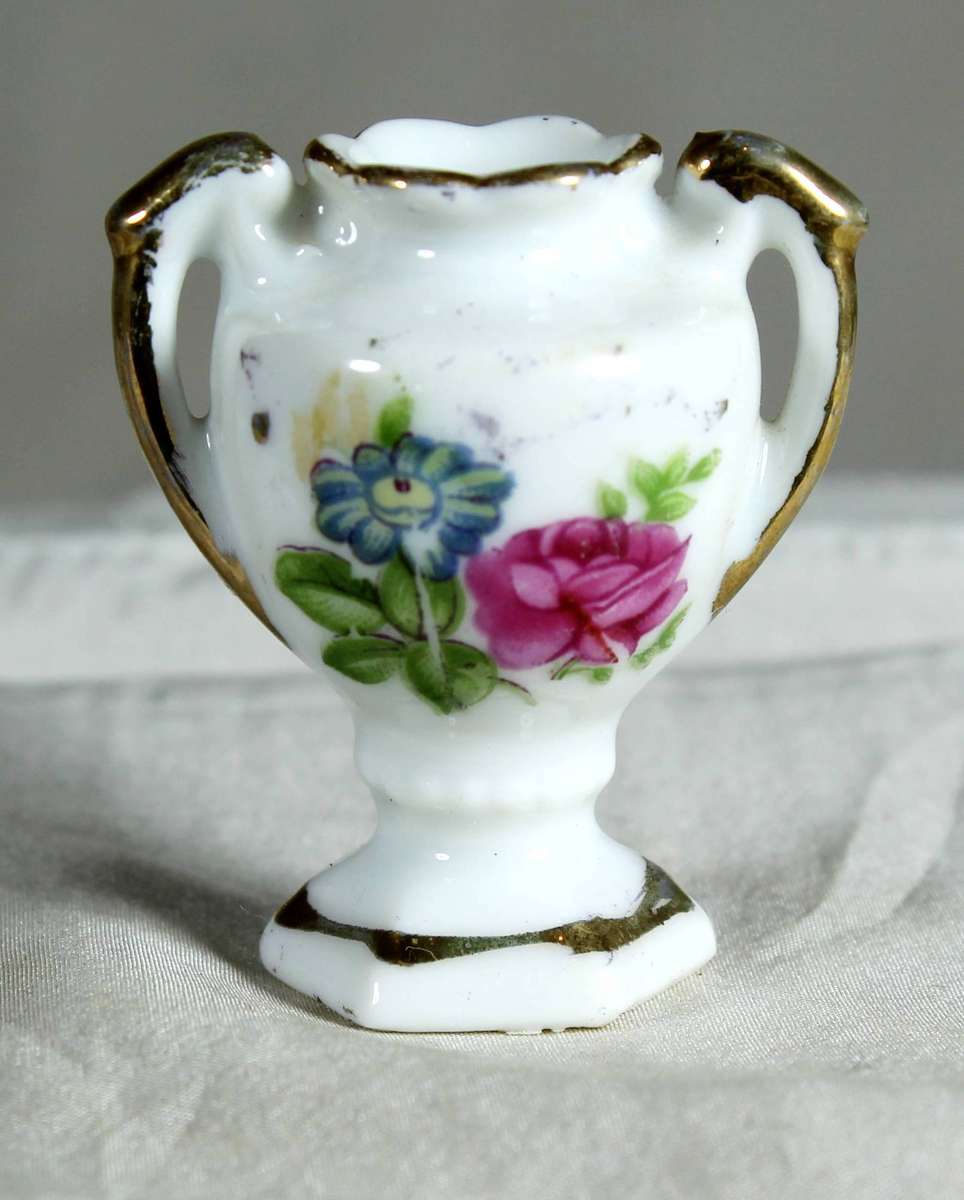 Miniature 2 handled porcelain vase in white