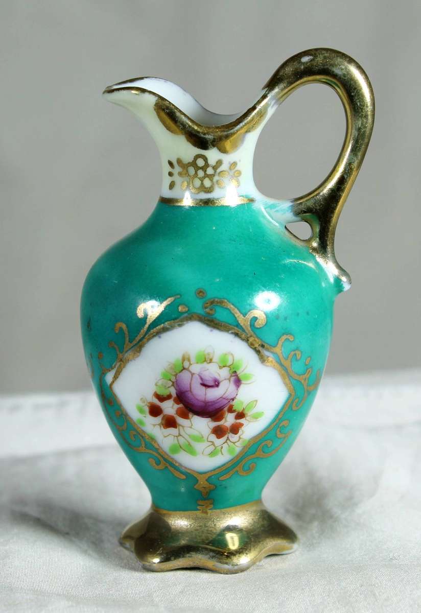 Small porcelain jug in green
