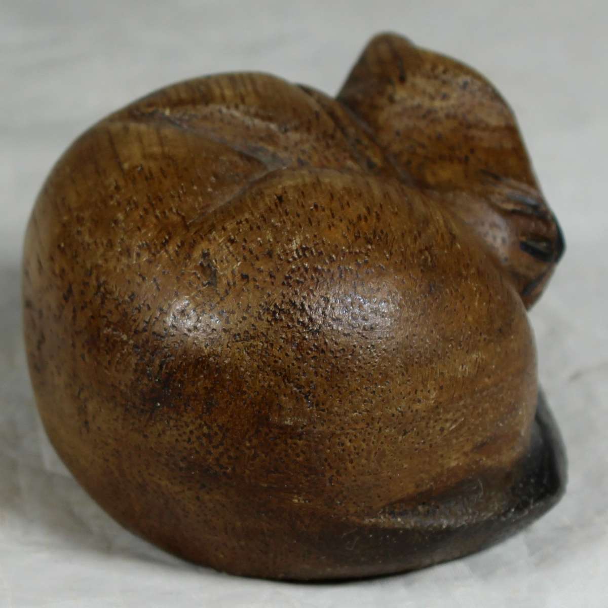 Carved wooden cat sleeping
