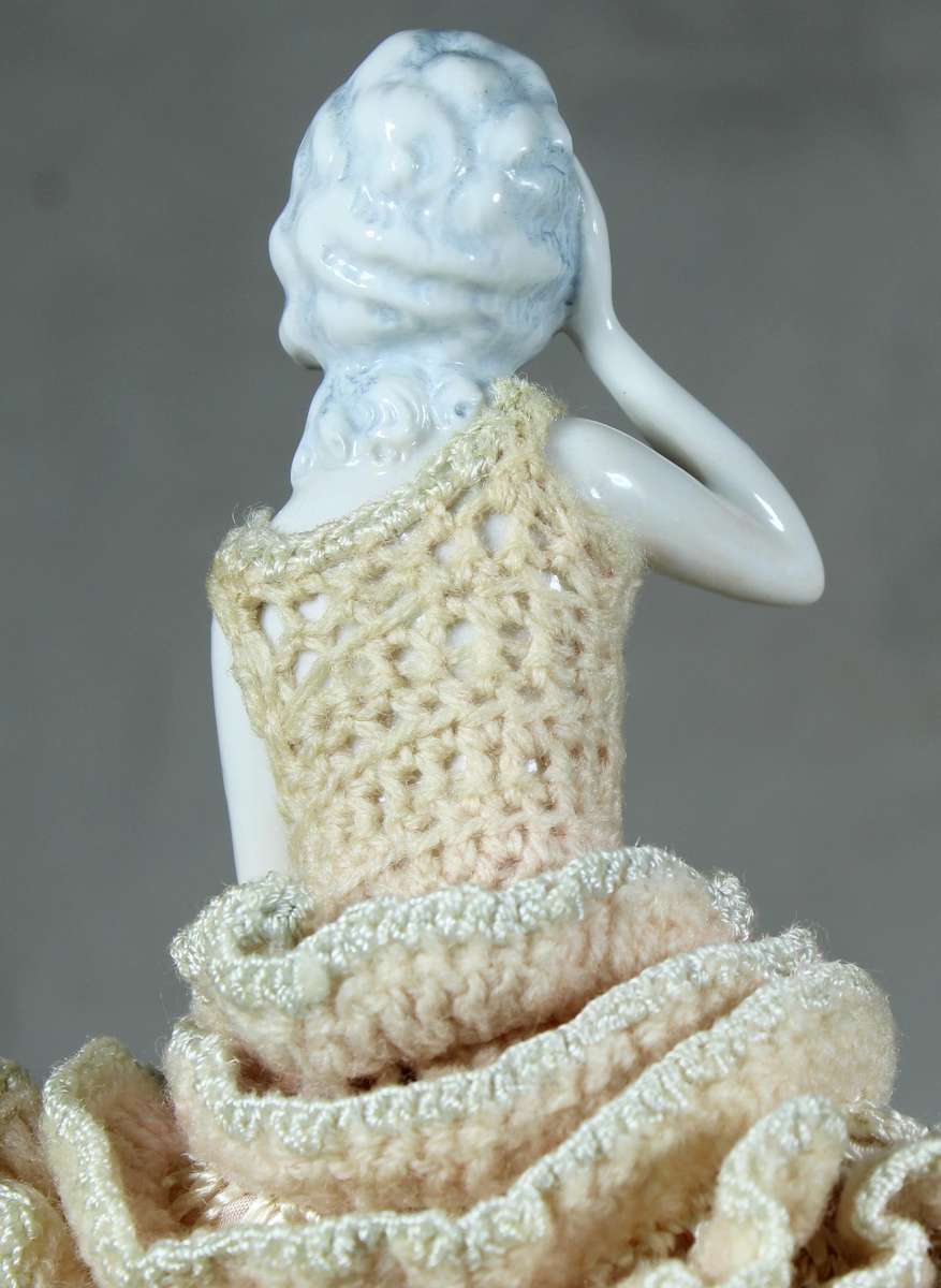 Half doll with pink dress