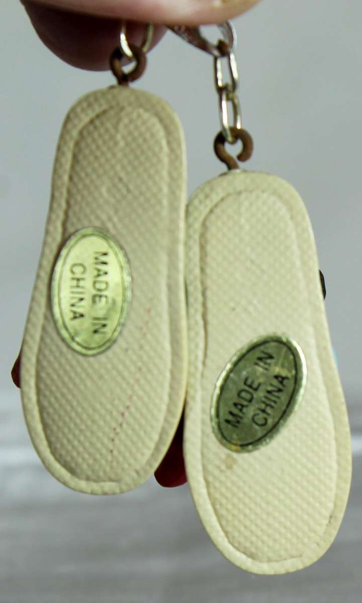 Pair of miniature cats in slippers