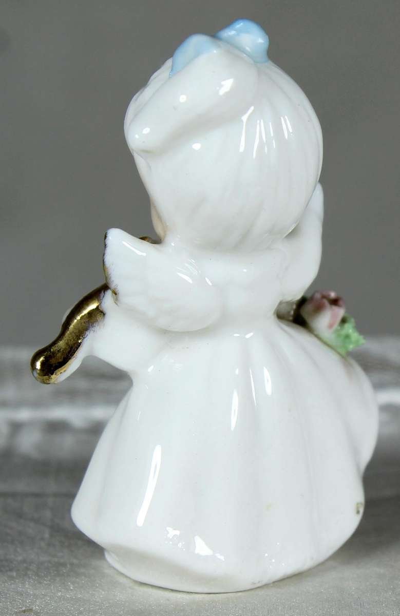 Miniature angel playing a violin
