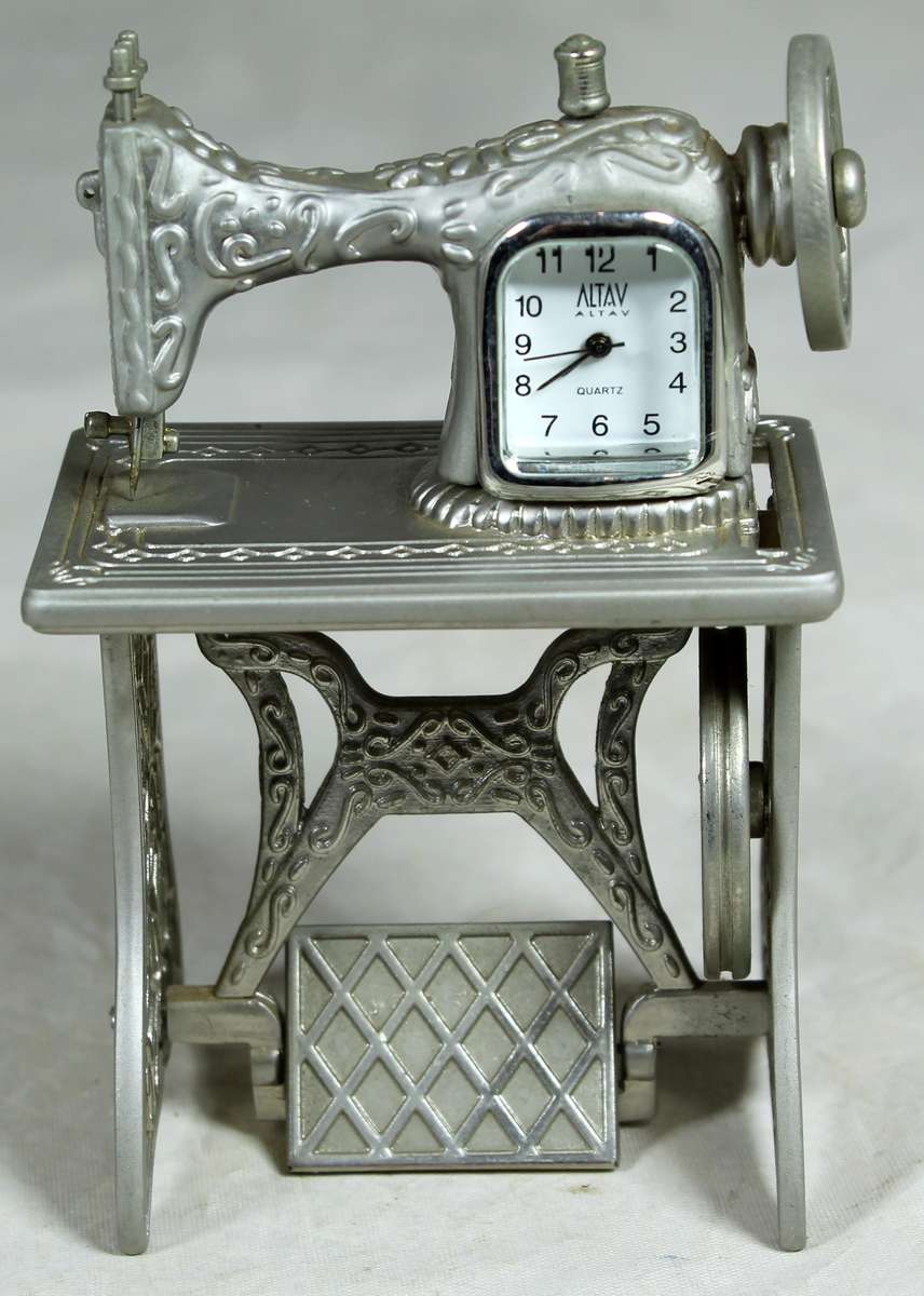 Small metal pedal sewing machine with clock