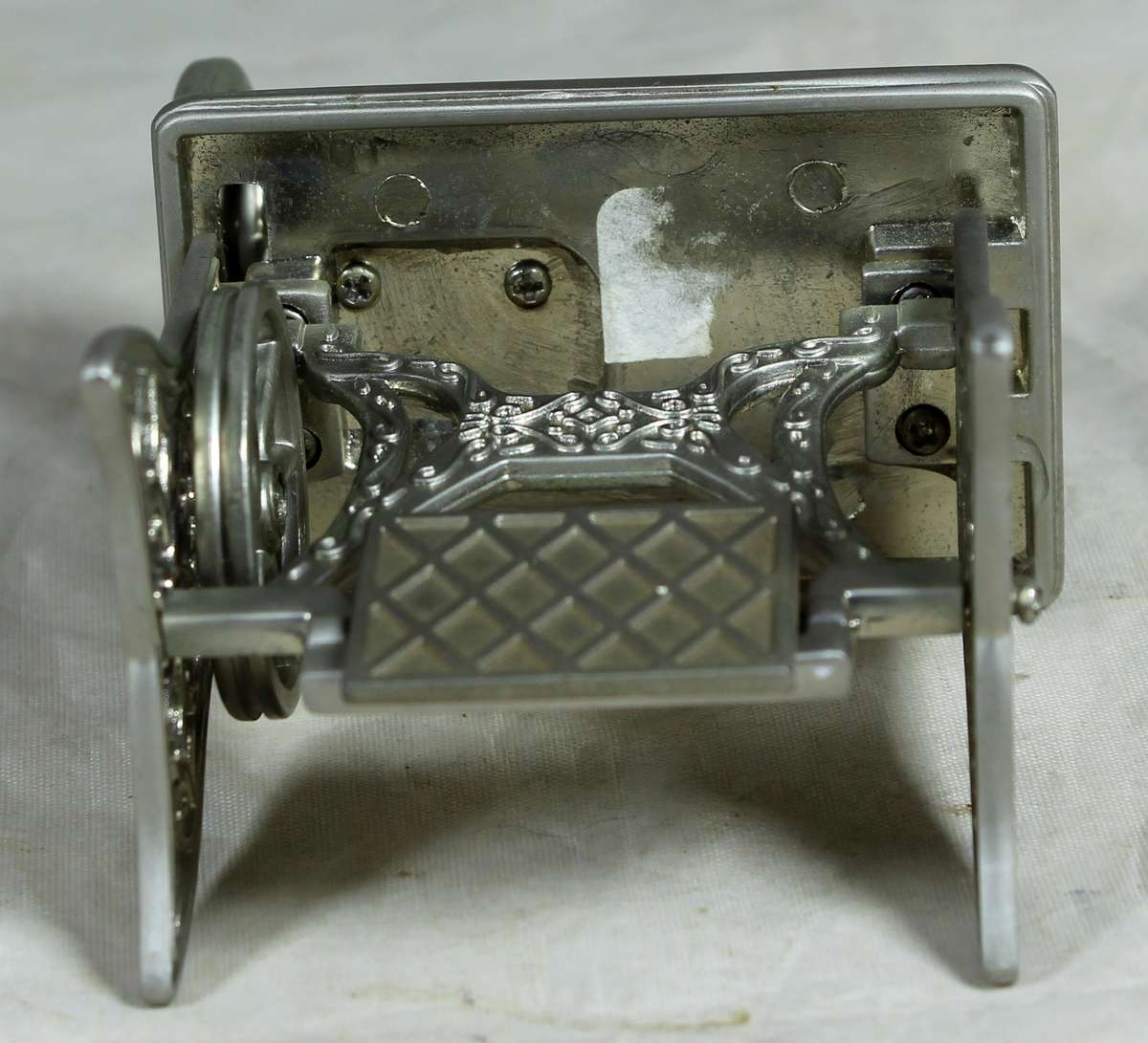 Small metal pedal sewing machine with clock