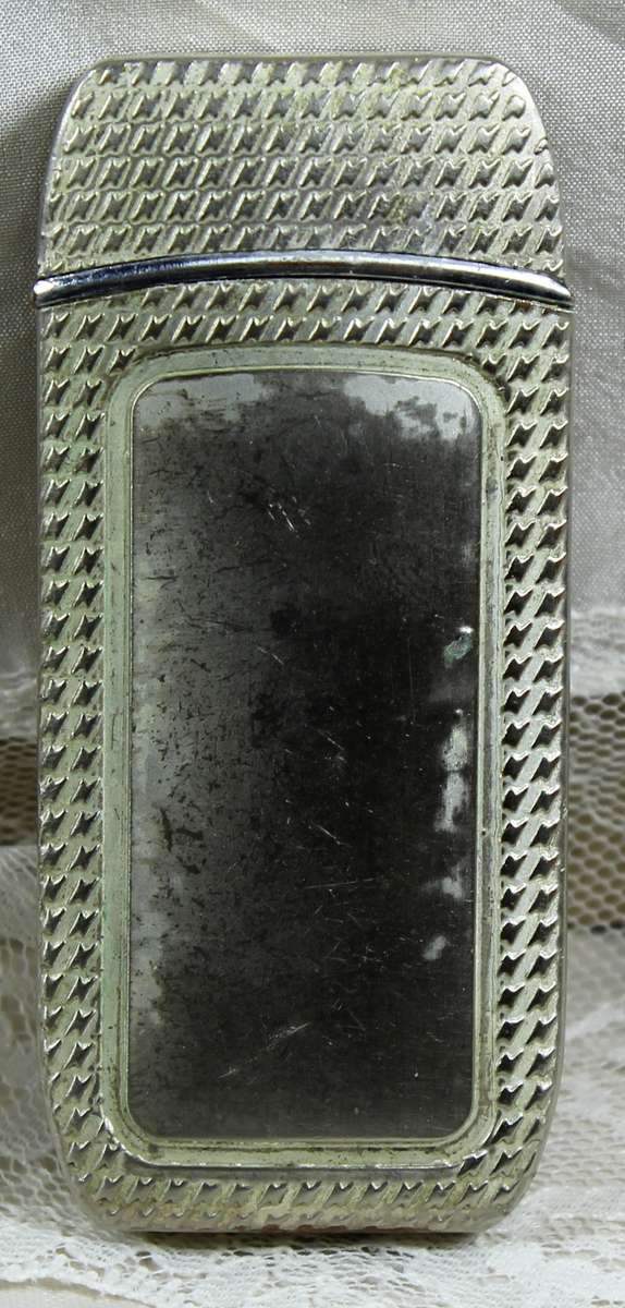 Vintage silver bikini lighter