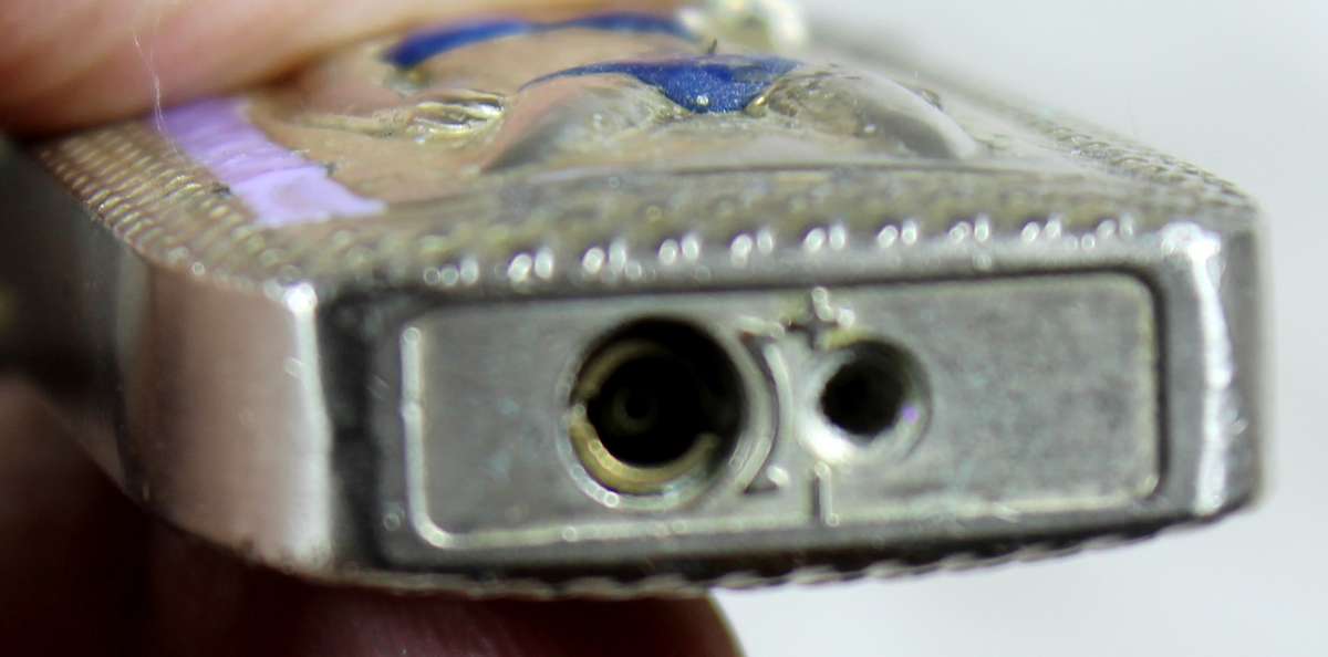 Vintage silver bikini lighter