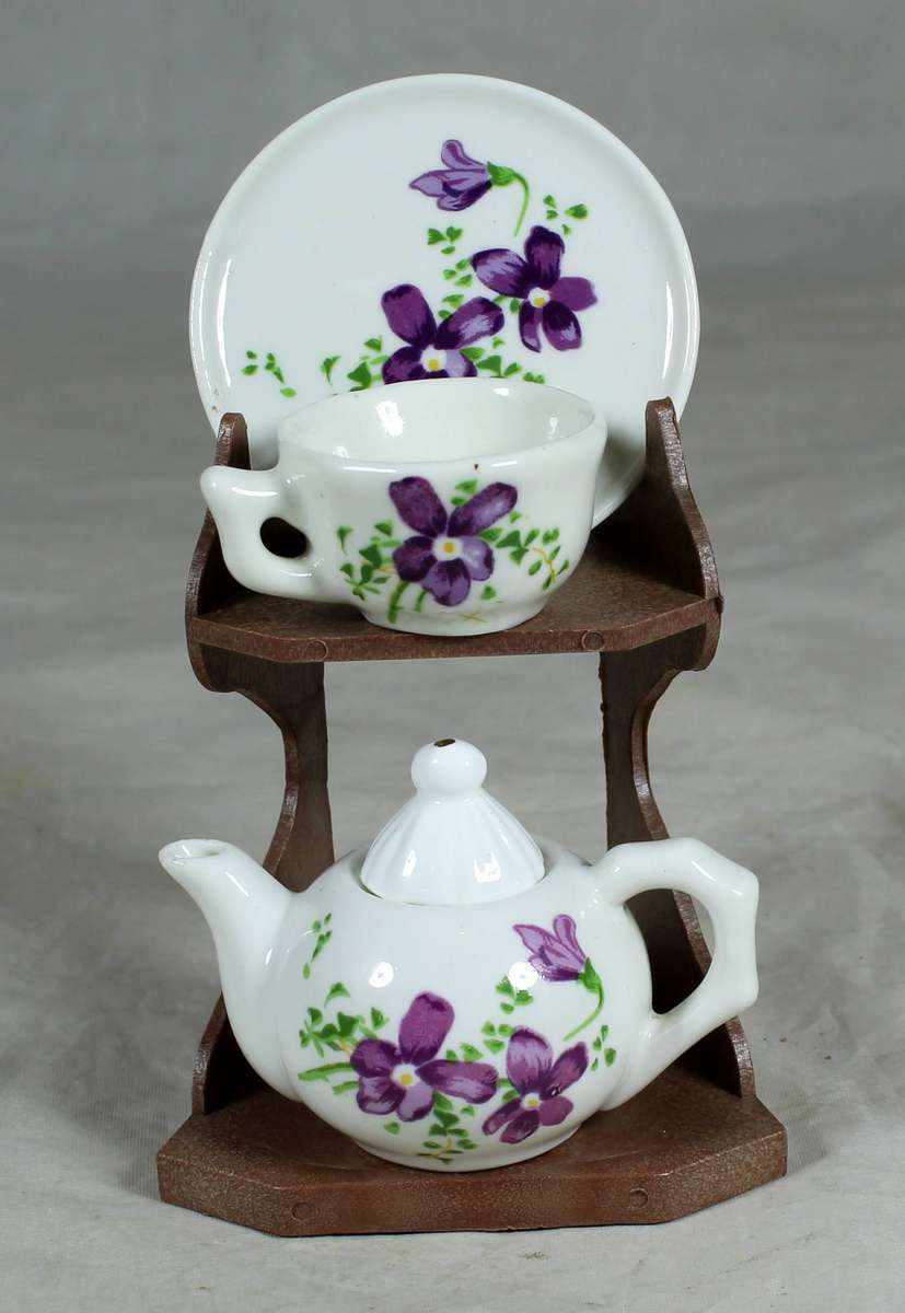 Miniature tea for one - purple flowers on a stand